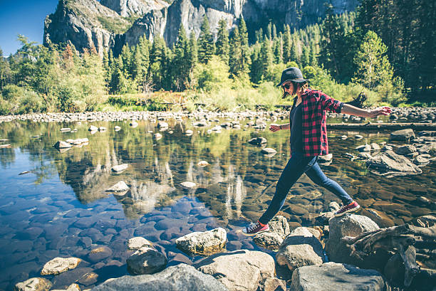 Optimistic woman trailblazing a pathway, embodying the journey of career discovery with UM's PathFinder™.